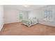Spacious bedroom with two windows, blinds, and carpeted floors at 122 Balsam Cir, Summerville, SC 29485