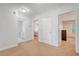 Hallway featuring carpet, doors, and white walls at 122 Balsam Cir, Summerville, SC 29485