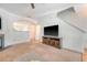 Bright living room featuring a fireplace, ceiling fan, neutral paint, and archway to the dining area at 122 Balsam Cir, Summerville, SC 29485