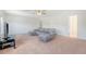 Large living room includes a comfortable sofa and offers great natural light at 122 Balsam Cir, Summerville, SC 29485