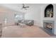 Cozy living room with a comfortable sectional sofa, fireplace, and window offering natural light at 122 Balsam Cir, Summerville, SC 29485
