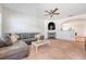 Spacious living room featuring a fireplace, ceiling fan, neutral paint, and archway to the dining area at 122 Balsam Cir, Summerville, SC 29485