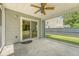 Cozy covered patio with ceiling fan, sliding glass doors, and view of the backyard at 122 Balsam Cir, Summerville, SC 29485