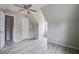 Upstairs bedroom with wood-look flooring, angled ceilings, and a closet with door at 123 Wheeler Rd, Summerville, SC 29486