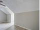 Upstairs bedroom with light-colored walls, angled ceilings, and wood-look flooring at 123 Wheeler Rd, Summerville, SC 29486