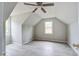 Upstairs bedroom with wood-look flooring, angled ceilings, and windows with outside views at 123 Wheeler Rd, Summerville, SC 29486
