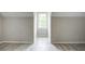 Bright bedroom featuring new floors and a centered window offering natural light at 123 Wheeler Rd, Summerville, SC 29486