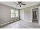 This bedroom features light gray walls, wood-look flooring and a ceiling fan at 123 Wheeler Rd, Summerville, SC 29486