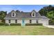 Charming one-story home featuring dormer windows and a vibrant blue front door at 123 Wheeler Rd, Summerville, SC 29486