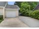 Attached one-car garage with white door and a driveway at 123 Wheeler Rd, Summerville, SC 29486