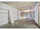 Spacious garage with shelving for storage and a roll up door at 123 Wheeler Rd, Summerville, SC 29486
