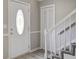 Hallway with entry door, closet, and staircase with carpet and white railings at 123 Wheeler Rd, Summerville, SC 29486