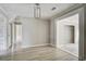 The hallway features gray walls and floors, white trim, and a view to other rooms at 123 Wheeler Rd, Summerville, SC 29486
