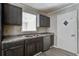 The kitchen features stainless steel appliances, gray cabinets, and updated countertops at 123 Wheeler Rd, Summerville, SC 29486