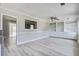 Spacious living area featuring modern floors, neutral paint, and lots of shelving at 123 Wheeler Rd, Summerville, SC 29486