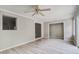 Living room featuring gray walls and floors, ceiling fan, and view to other rooms at 123 Wheeler Rd, Summerville, SC 29486