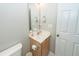 Bathroom featuring a toilet, vanity with wood cabinets, and a large mirror at 139 Spindle Way, Goose Creek, SC 29445