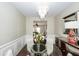 View of the bright dining area showcasing hardwood floors and modern lighting at 139 Spindle Way, Goose Creek, SC 29445