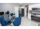 Eat-in kitchen area with a glass dining table and stainless steel appliances at 139 Spindle Way, Goose Creek, SC 29445