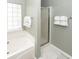 The relaxing garden tub and walk-in shower are highlighted in this bright and clean main bathroom at 139 Spindle Way, Goose Creek, SC 29445