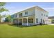 Enjoy outdoor living with this screened porch, perfect for relaxing and entertaining in the expansive backyard at 1411 Homecoming Blvd, Ravenel, SC 29470