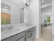 Bright bathroom with a double sink vanity, modern fixtures, and an adjacent bedroom view at 1411 Homecoming Blvd, Ravenel, SC 29470