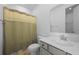 Compact bathroom featuring a single vanity and a shower-tub combo with a curtain at 1411 Homecoming Blvd, Ravenel, SC 29470