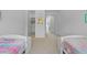 Shared bedroom with two beds and ample storage space, featuring a walk-in closet at 1411 Homecoming Blvd, Ravenel, SC 29470