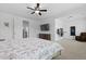 Comfortable bedroom featuring a TV, dresser, carpeted floor, and ceiling fan at 1411 Homecoming Blvd, Ravenel, SC 29470