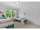 Charming bedroom with two beds, bright accents, and a view of lush greenery at 1411 Homecoming Blvd, Ravenel, SC 29470