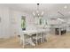 Dining area with backyard views, access to kitchen and white table with seating at 1411 Homecoming Blvd, Ravenel, SC 29470