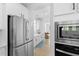 Modern kitchen featuring stainless steel appliances, white cabinets, and an integrated oven/microwave at 1411 Homecoming Blvd, Ravenel, SC 29470