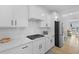 Contemporary kitchen featuring stainless steel appliances, sleek countertops, and white cabinets at 1411 Homecoming Blvd, Ravenel, SC 29470
