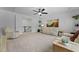 Bright living room featuring neutral toned furniture, a ceiling fan, and modern decor at 1411 Homecoming Blvd, Ravenel, SC 29470