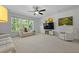 Living room featuring a large window, carpeted floor, TV, ceiling fan and comfortable seating at 1411 Homecoming Blvd, Ravenel, SC 29470