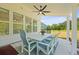 Outdoor patio with dining set and picturesque views of the backyard and trees at 1411 Homecoming Blvd, Ravenel, SC 29470