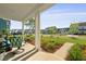 Inviting front porch with comfortable seating and views of the neighborhood at 1411 Homecoming Blvd, Ravenel, SC 29470