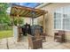Backyard patio with an outdoor kitchen and comfortable seating, perfect for gatherings at 1485 Endicot Way, Mount Pleasant, SC 29466