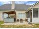 Backyard patio features outdoor kitchen, seating area, and screened in porch at 1485 Endicot Way, Mount Pleasant, SC 29466