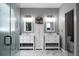 Bathroom showcasing a modern vanity with double sinks, a storage cabinet, and a glass shower at 1485 Endicot Way, Mount Pleasant, SC 29466