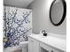 Bathroom featuring a floral shower curtain, framed mirror, and traditional fixtures at 1485 Endicot Way, Mount Pleasant, SC 29466