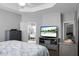 A modern bedroom featuring an entertainment center with a television and an attached bathroom at 1485 Endicot Way, Mount Pleasant, SC 29466