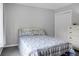 Cozy bedroom with floral bedding, gray walls, and a closet with white double doors at 1485 Endicot Way, Mount Pleasant, SC 29466