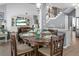 Open-concept dining area with bar top and view of the living room and staircase at 1485 Endicot Way, Mount Pleasant, SC 29466