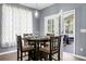 Dining area with a table set for four and French doors leading to a screened-in porch at 1485 Endicot Way, Mount Pleasant, SC 29466