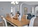 Open concept dining room featuring stylish table setting, neutral decor and easy access to living area at 1485 Endicot Way, Mount Pleasant, SC 29466