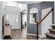 Bright foyer with high ceilings, staircase, and elegant décor, showcasing the home's entrance at 1485 Endicot Way, Mount Pleasant, SC 29466