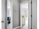 Hallway view into two bedrooms with neutral wall paint and carpet at 1485 Endicot Way, Mount Pleasant, SC 29466
