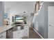Kitchen area with stainless steel sink, cabinets, and open access to living areas and staircase at 1485 Endicot Way, Mount Pleasant, SC 29466