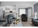 Open concept living room with a view of the kitchen, dining area and comfortable leather seating at 1485 Endicot Way, Mount Pleasant, SC 29466
